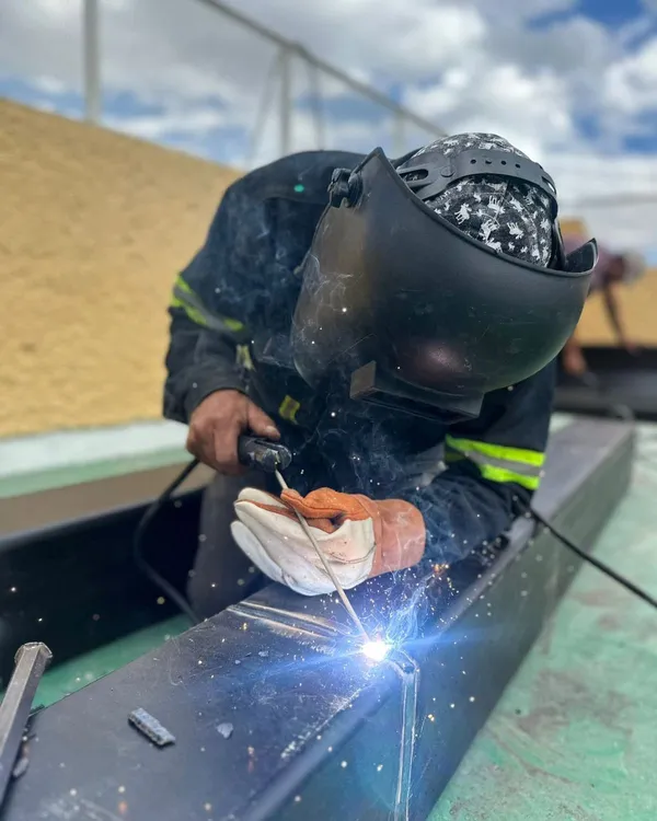 Grandmother and granddaughter laughing together while playing on the grass